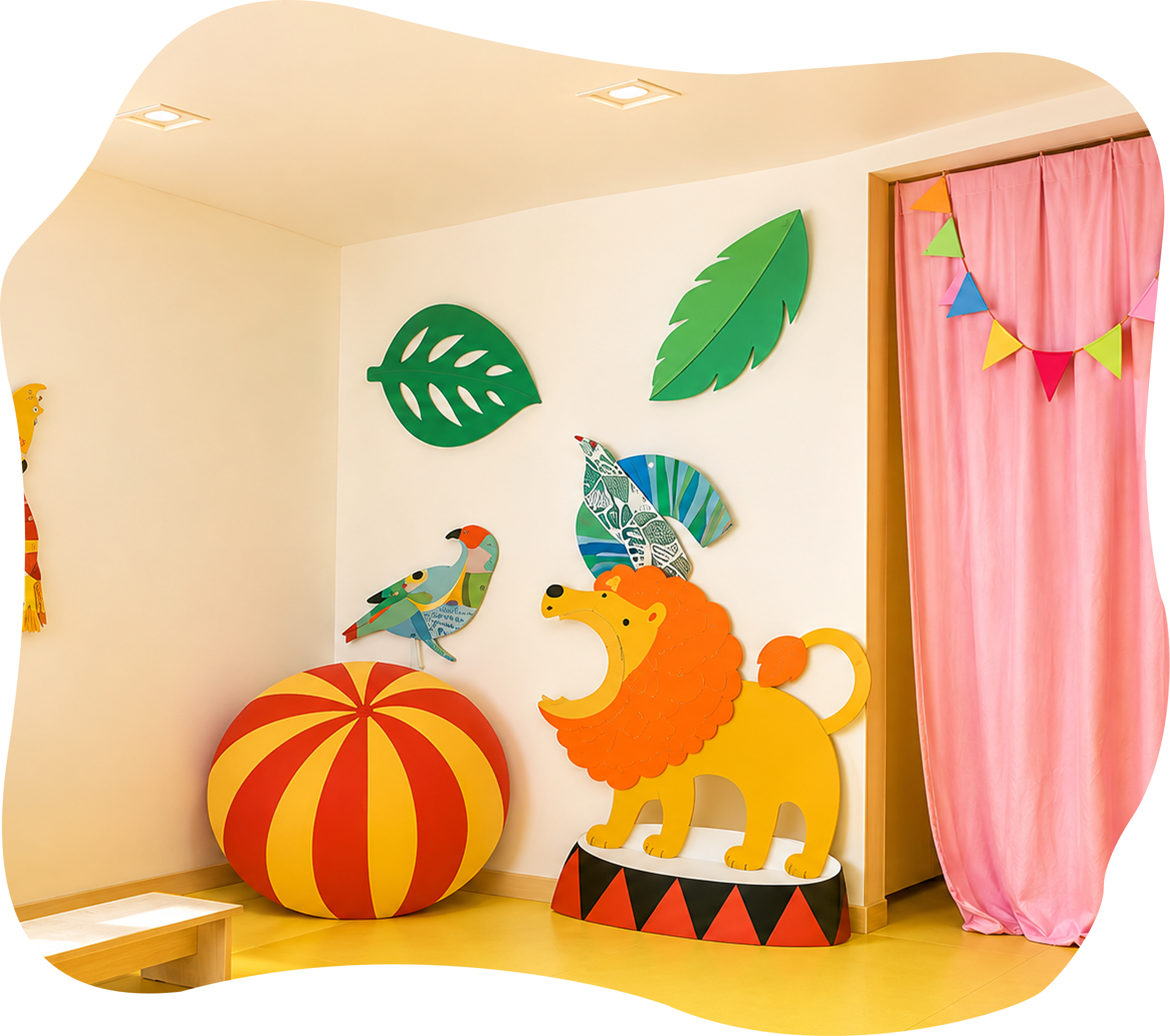 A colorful, playfully decorated Kidnasium playroom with a lion display, bird, and pink curtain